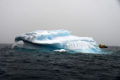 05A Zodiac With Iceberg With A Window In Foyn Harbour On Quark Expeditions Antarctica Cruise.jpg